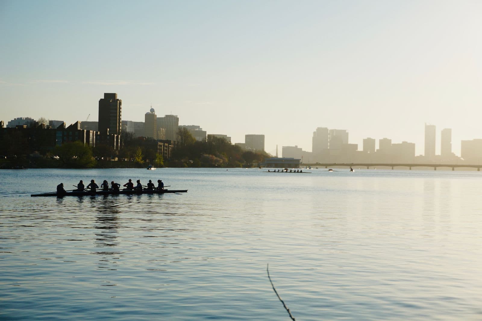 A rowing crew on the water at sunrise